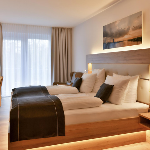 Deluxezimmer Wohnraum/Bett