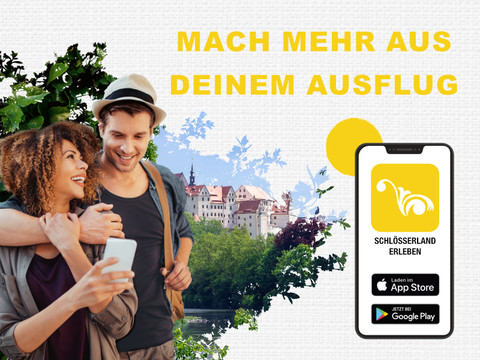 Colditz Castle with Schloesserland-erleben app A couple uses the Schloesserland-erleben app in front of Colditz Castle.