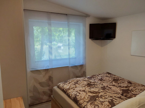 Ferienhaus am Mühlenteich, Schlafzimmer mit Fernsehen Ferienhaus am Mühlenteich, Schlafzimmer mit Fernsehen