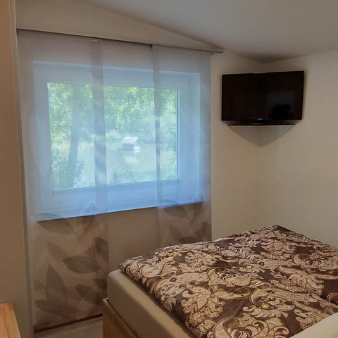 Ferienhaus am Mühlenteich, Schlafzimmer mit Fernsehen Ferienhaus am Mühlenteich, Schlafzimmer mit Fernsehen