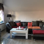 Ferienwohnung Fischer - Wohnzimmer mit Kamin