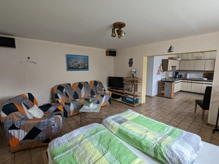 app_diedrich_WohnSchlafen.jpg Kombinierter Wohn-Schlafbereich mit Blick in die offene KücheCombined living/sleeping area with a view of the open kitchen