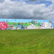 Gemälde Lager 3000 Das Bild zeigt ein Graffitigemälde an einer Hauswand des Lager 3000 in Wiefelstede