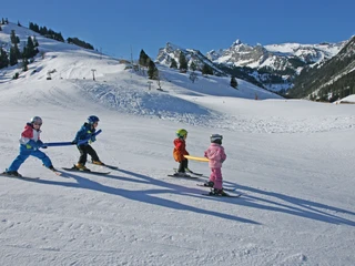 Fun with other children at the Grimmialp Ski School