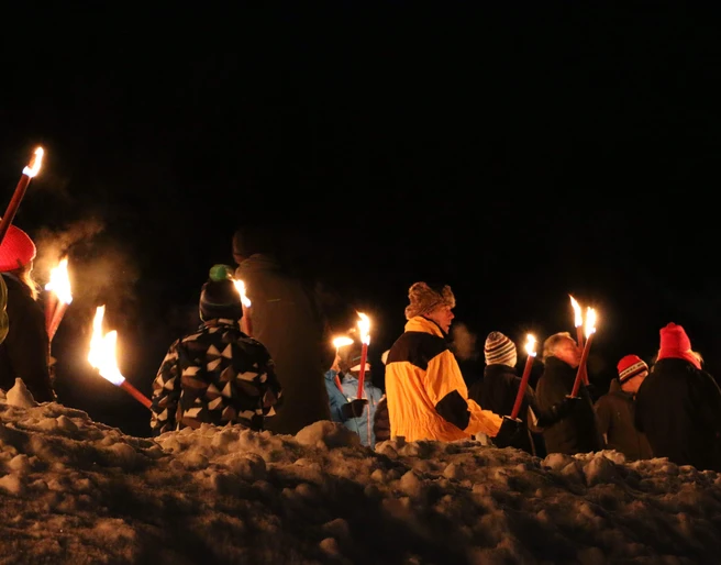 Torches light up the cold winter night