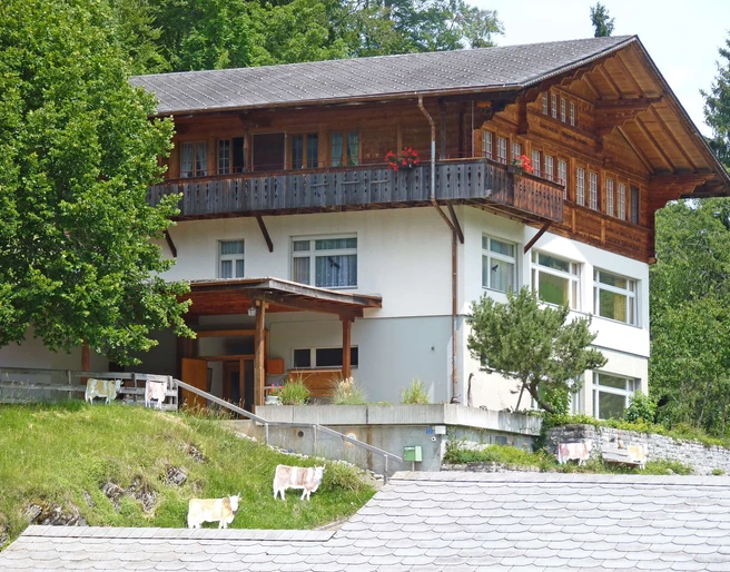 The old schoolhouse towers over Entschwil like an eagle's nest