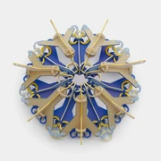 Svenja John, brooch "NOKOMIS" Bunte Brosche aus geometrischen Elementen, die sternförmig angeordnet sind auf grauem Hintergrund.Colorful brooch made of geometric elements arranged in a star shape on a grey background.
