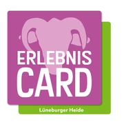 Das Logo der ErlebnisCard Lüneburger Heide mit stilisiertem Elefantenkopf auf violettem Hintergrund.