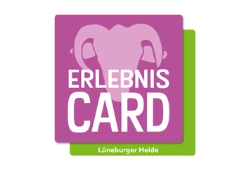 erlebniscard-lueneburger-heide.jpg Das Logo der ErlebnisCard Lüneburger Heide mit stilisiertem Elefantenkopf auf violettem Hintergrund.