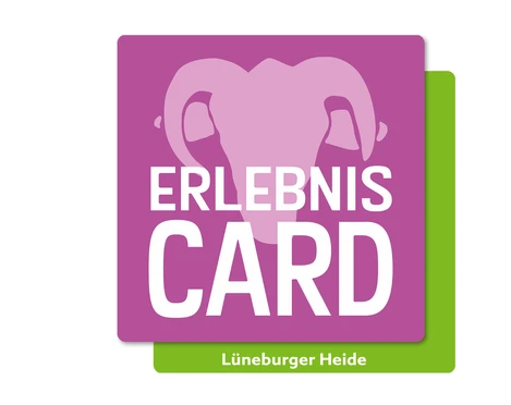 erlebniscard-lueneburger-heide.jpg Das Logo der ErlebnisCard Lüneburger Heide mit stilisiertem Elefantenkopf auf violettem Hintergrund.