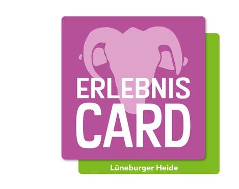 erlebniscard-lueneburger-heide.jpg Das Logo der ErlebnisCard Lüneburger Heide mit stilisiertem Elefantenkopf auf violettem Hintergrund.