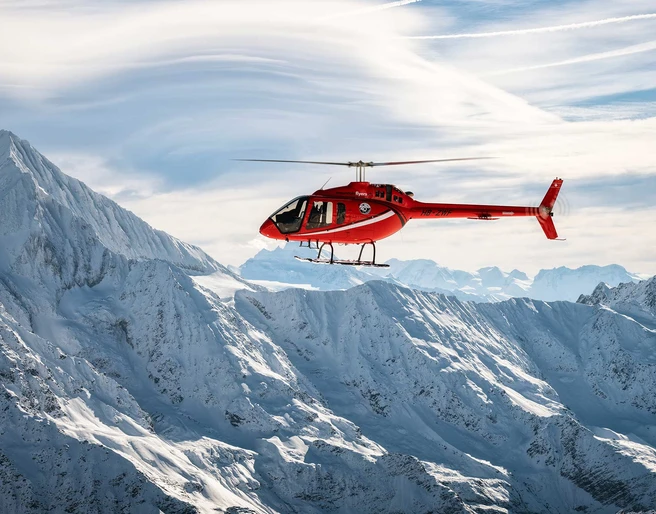 mountain-flyers-belp-titelbild-helokopter-berge-schnee.jpg