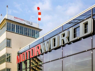 Tower and Michael Schumacher Hall at Motorworld Cologne Der moderne Glaspavillon der Motorworld Köln ist zu sehen, daneben der dazugehörige Tower.The modern glass pavilion of Motorworld Köln can be seen, with the tower next to it.