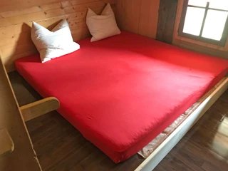 Chambre à coucher lit double chalet d'alpage Brüschtmoos