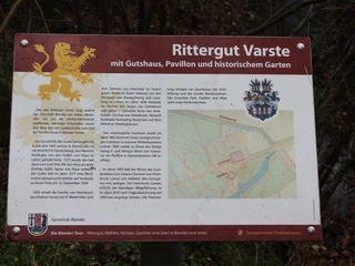 Rittergut Varste Infotafel über Rittergut Varste mit Hauswappen, Karte des Geländes und Text zur Geschichte.