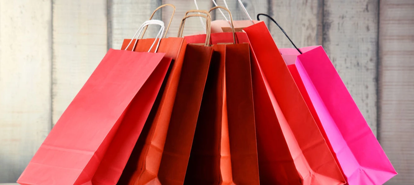 Composition with red paper shopping bags