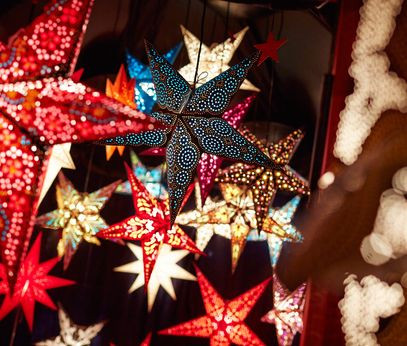 Colorful decoration stars at the Stadtgarten Christmas market